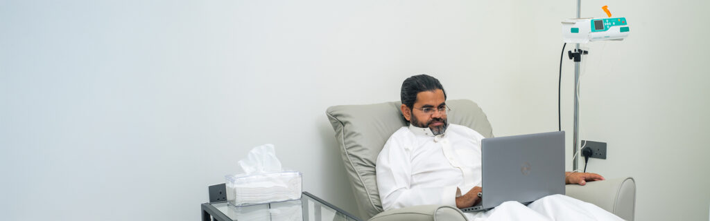 Patient receiving IV therapy for chronic illness at IV One Riyadh