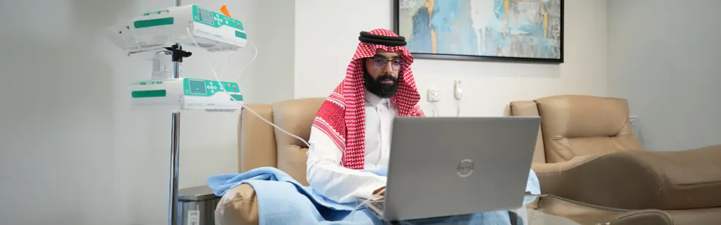 Patient receiving IV therapy for autoimmune disease at a Riyadh clinic