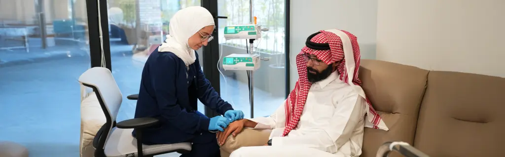 Doctor preparing IV infusion for chronic illness management